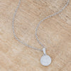 Lovely Rhodium Necklace with CZ Disk Pendant